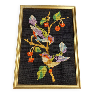 Vintage tapestry framed birds on black background
