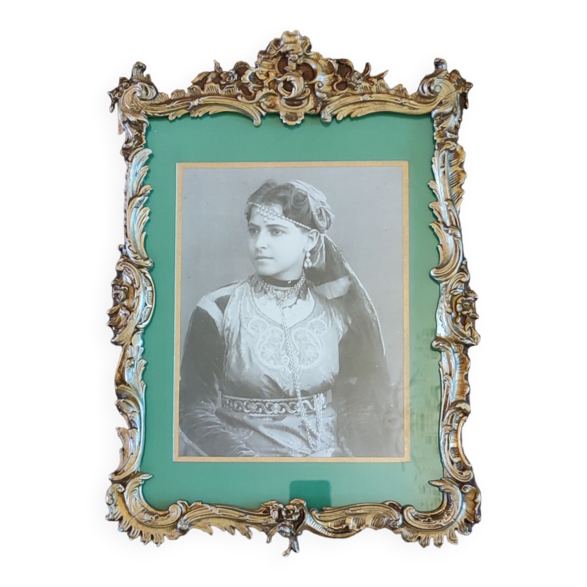 Old wooden frame and bronze ornament