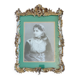 Old wooden frame and bronze ornament