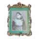 Old wooden frame and bronze ornament