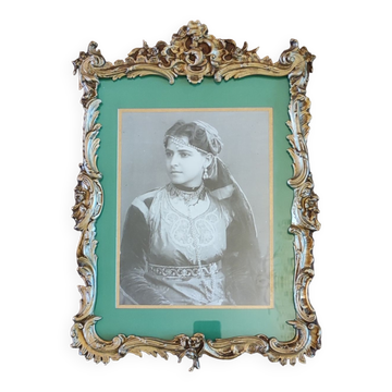 Old wooden frame and bronze ornament