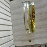 Empty round pockets of iridescent transparent glass of yellow sticks