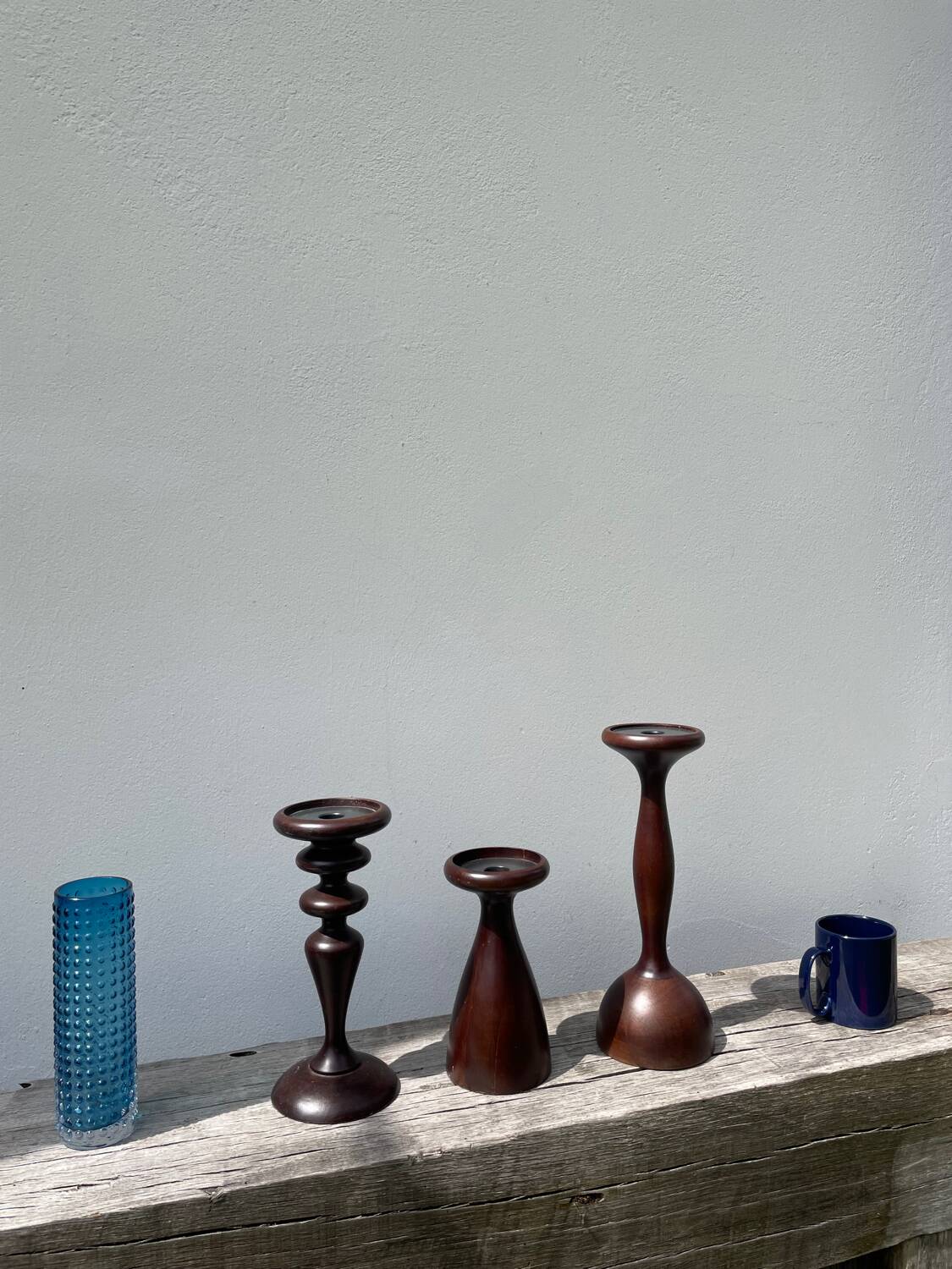 Trio of large turned wooden candlesticks