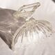 Oval glass fruit bowl on a stand.