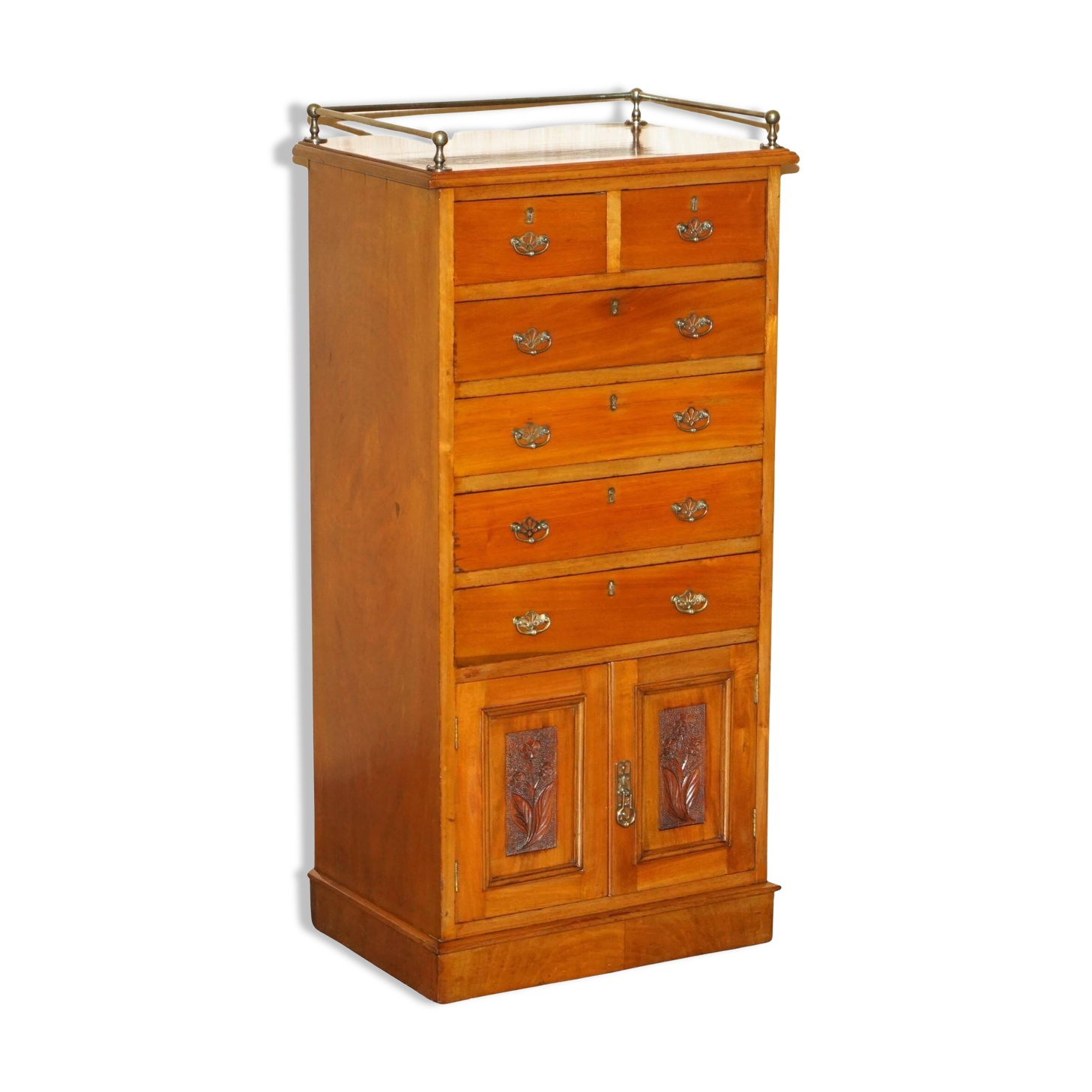 Victorian high chest of drawers in walnut with a bronze gallery.