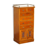 Victorian high chest of drawers in walnut with a bronze gallery.