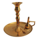 Old candlestick with brass extinguisher.