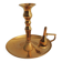 Old candlestick with brass extinguisher.