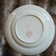 13 mismatched flat plates in ironstone