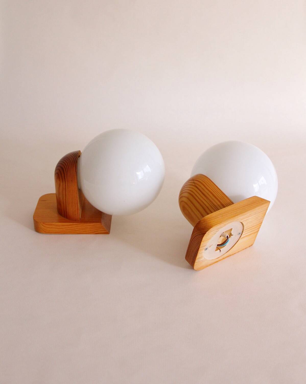 Pair of wall lights in pine and opaline, 1960s.