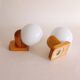 Pair of wall lights in pine and opaline, 1960s.
