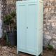 Vintage Parisian wardrobe in grey-blue green.