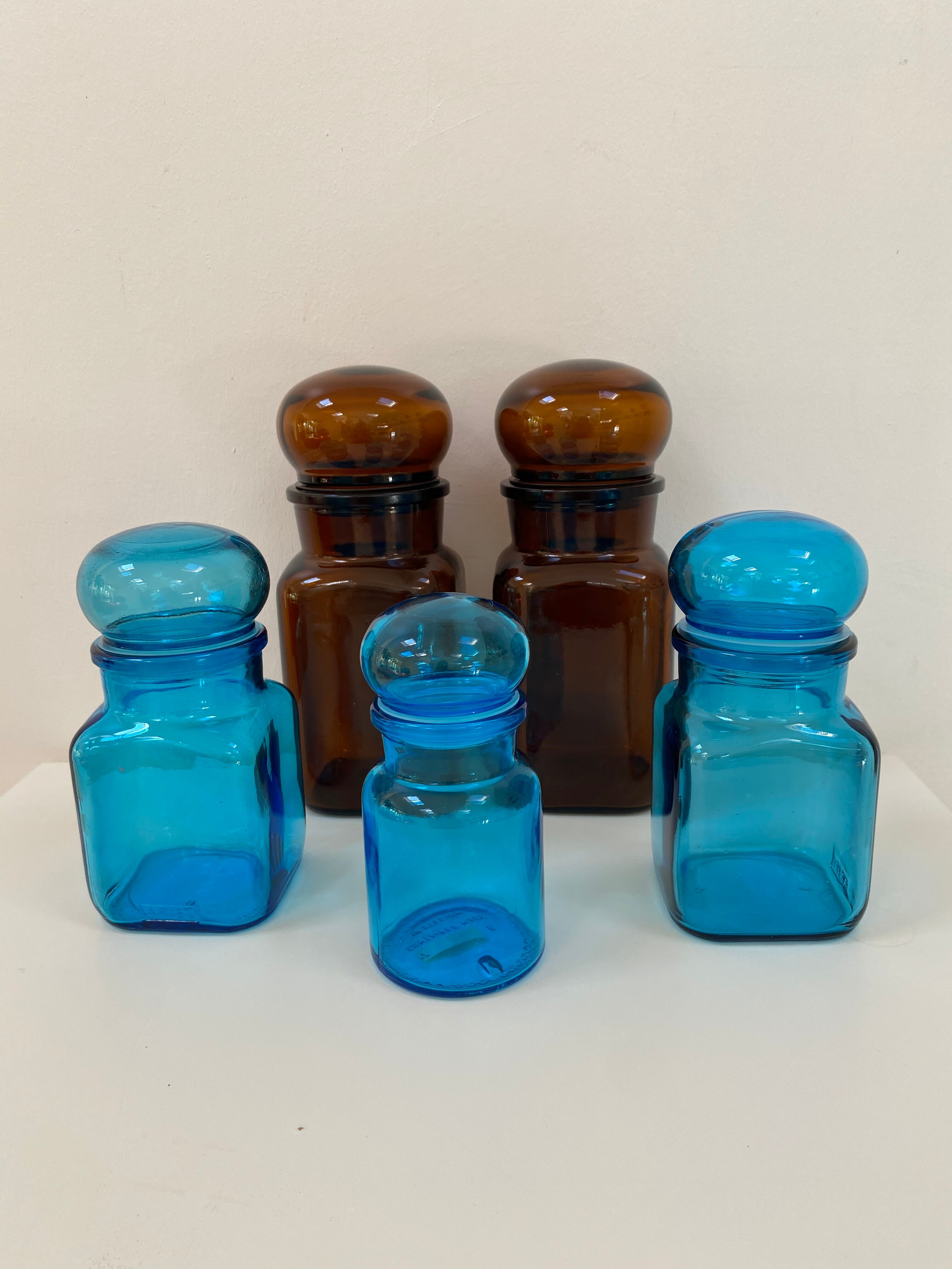 Trio of vintage turquoise blue glass jars