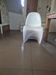 10 white chairs in the style of Verner Panton