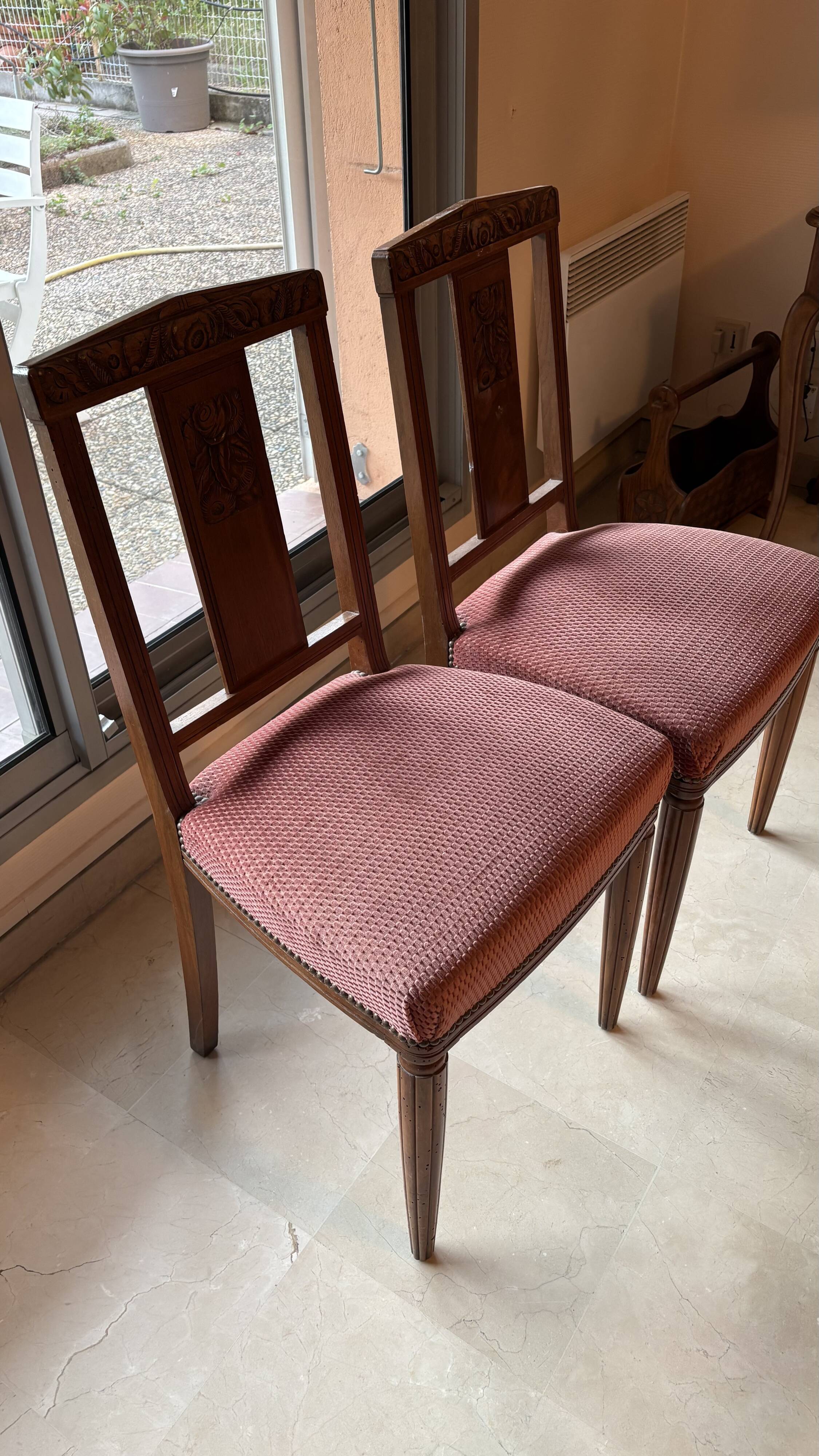 Set of 2 wooden chairs with padded seats.