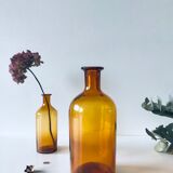 Duo of ancient apothecary flakes in amber glass