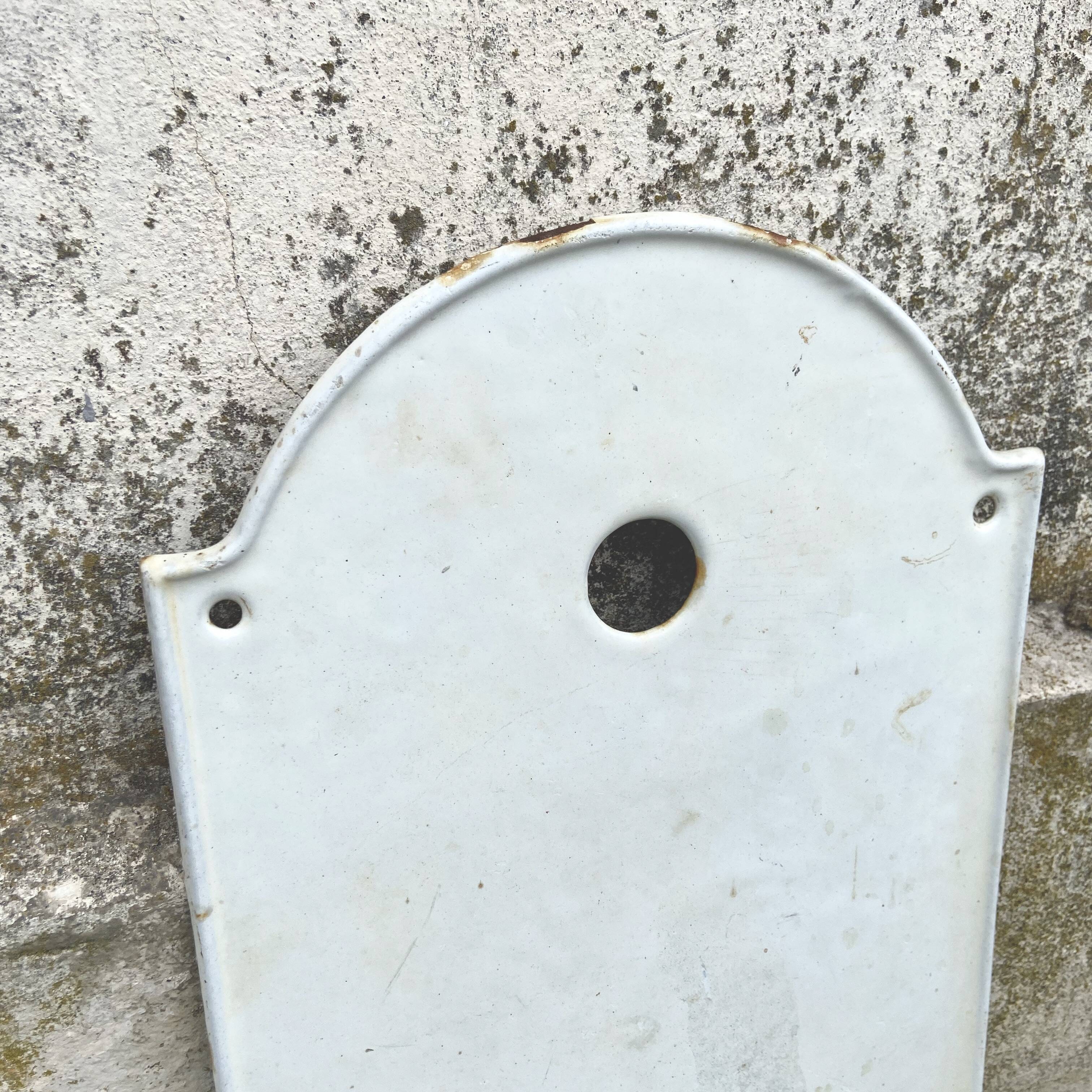 White enameled cast iron wall fountain