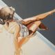 Seated woman painting