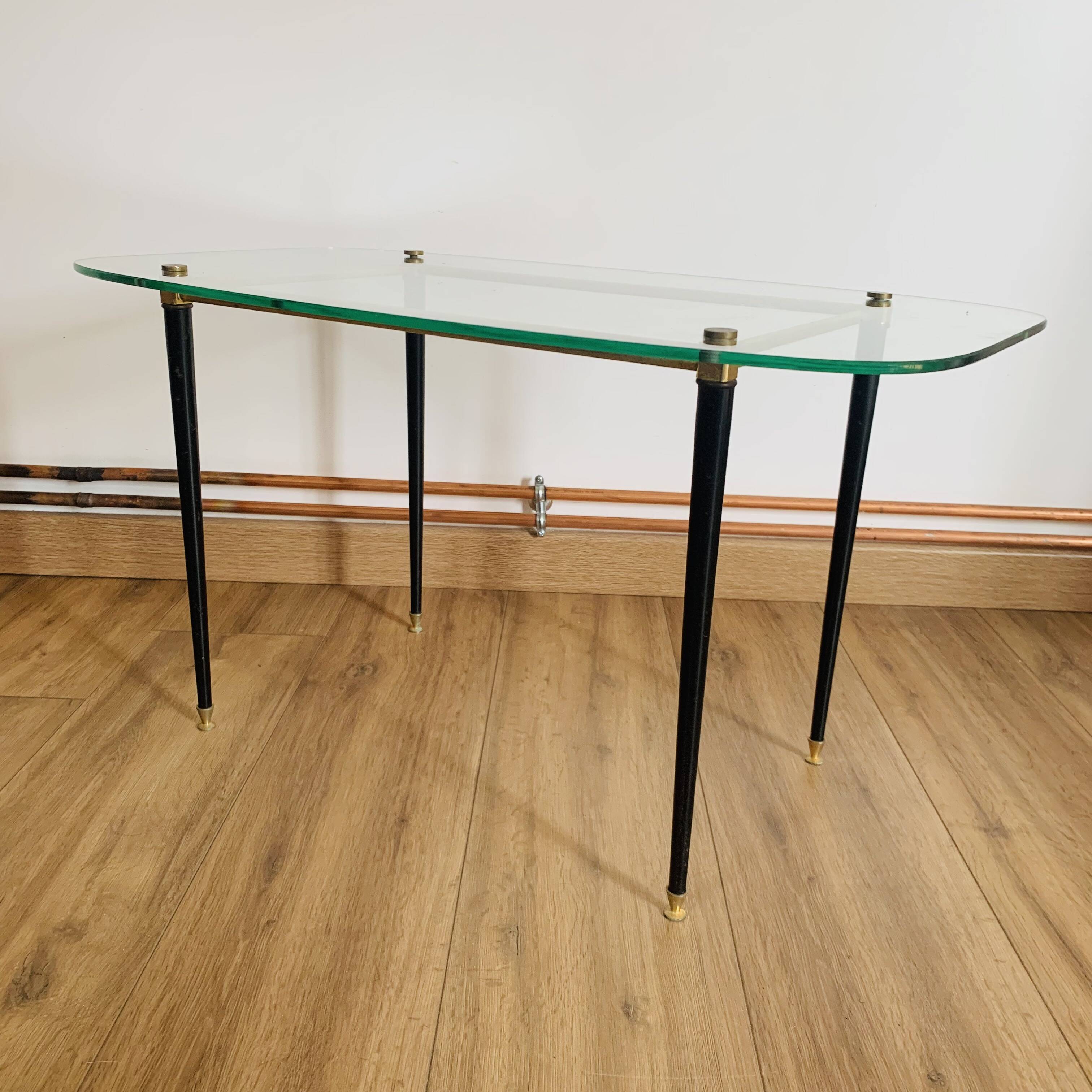 Coffee table from the 50s/60s, glass, brass, black metal.