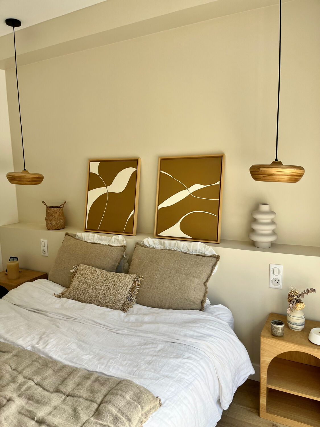 Diptych relief panels with a brown camel and cream background.