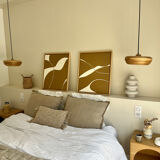 Diptych relief panels with a brown camel and cream background.