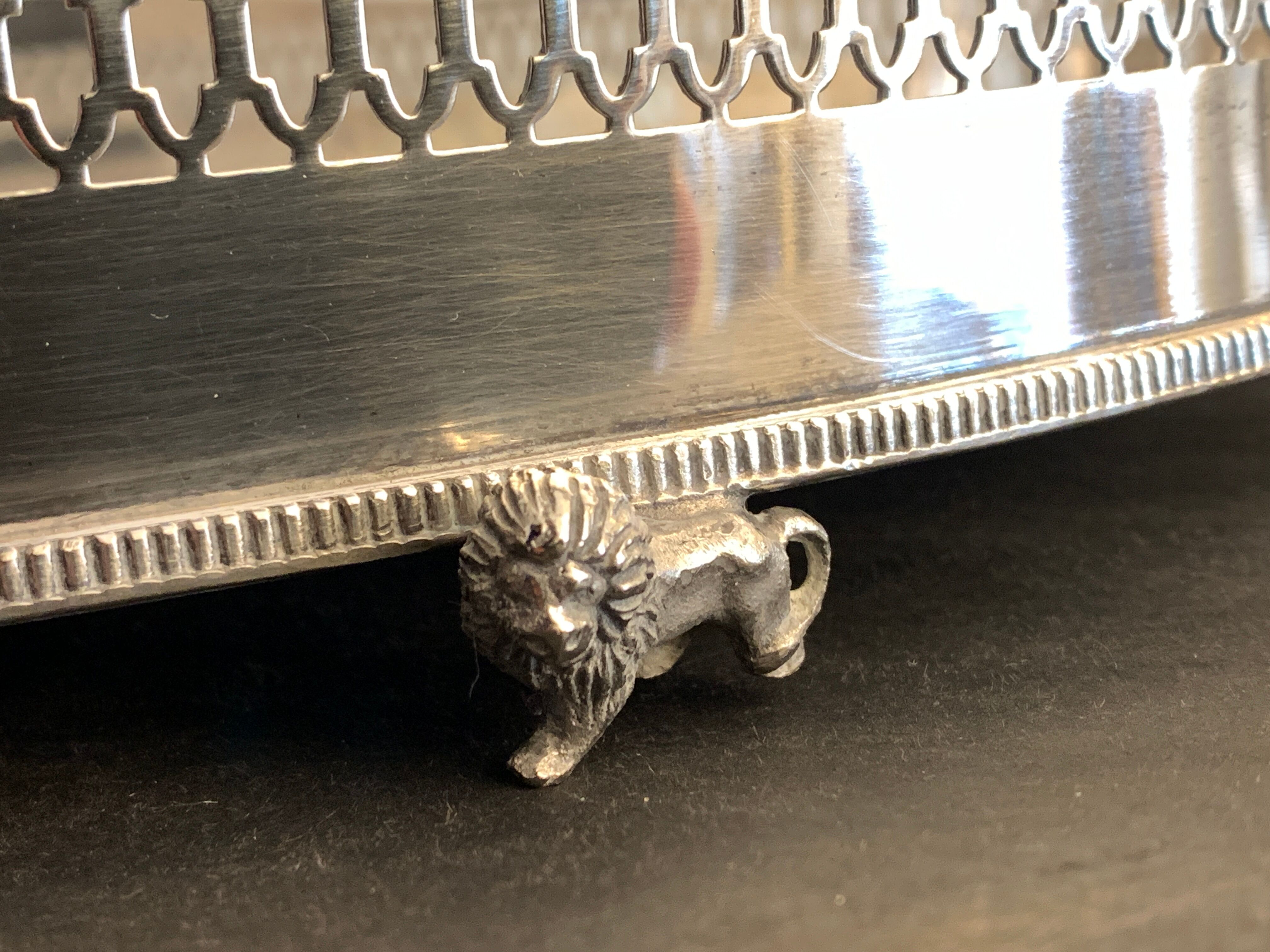 Alpaca silver metal to  lion feet and openwork borders