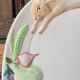 Very large serving dish with hares and vegetables.