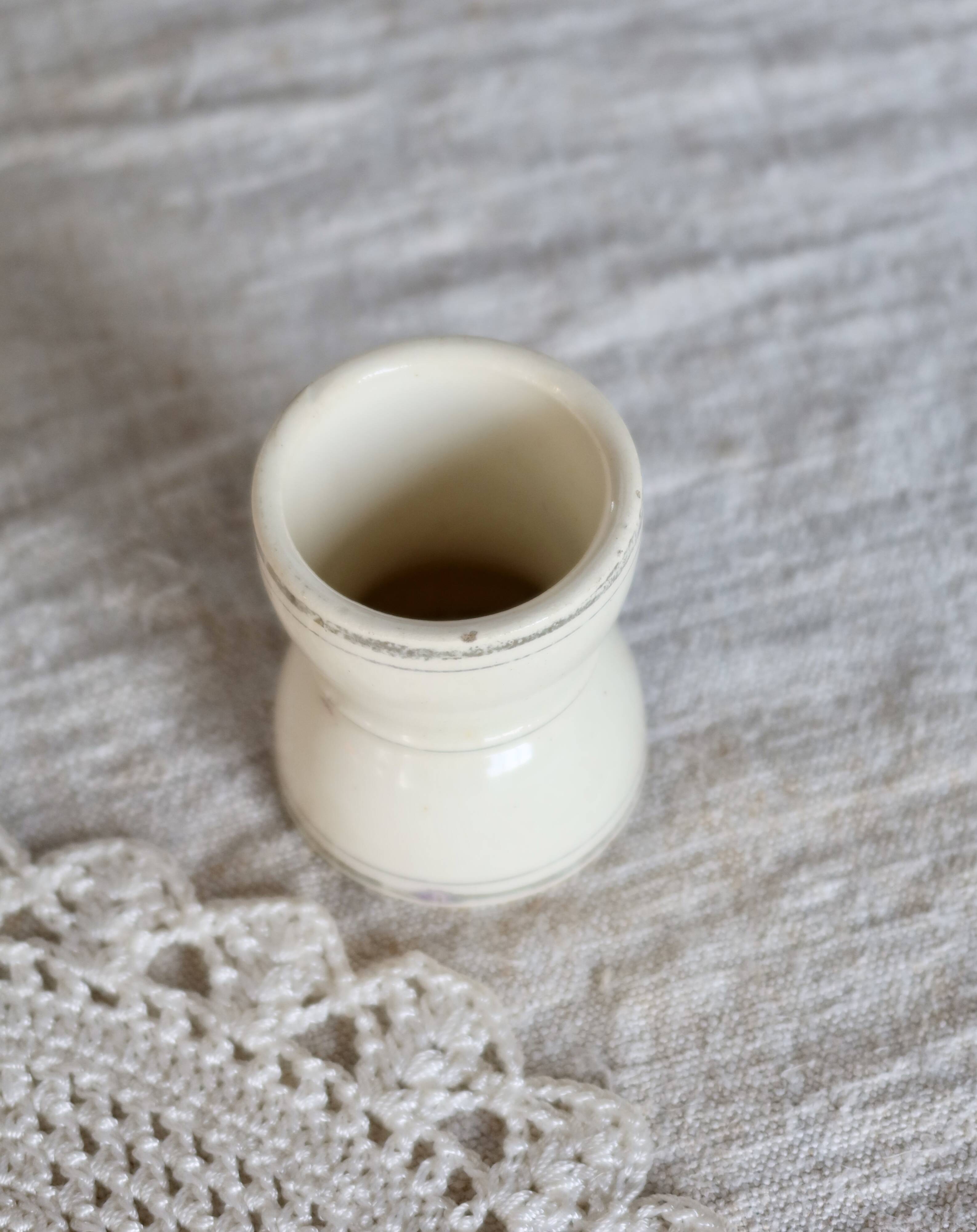 Antique egg cup, ironstone diabolo, ivory and gold edging