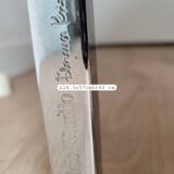 Knoll coffee table with smoked glass top and chrome metal.