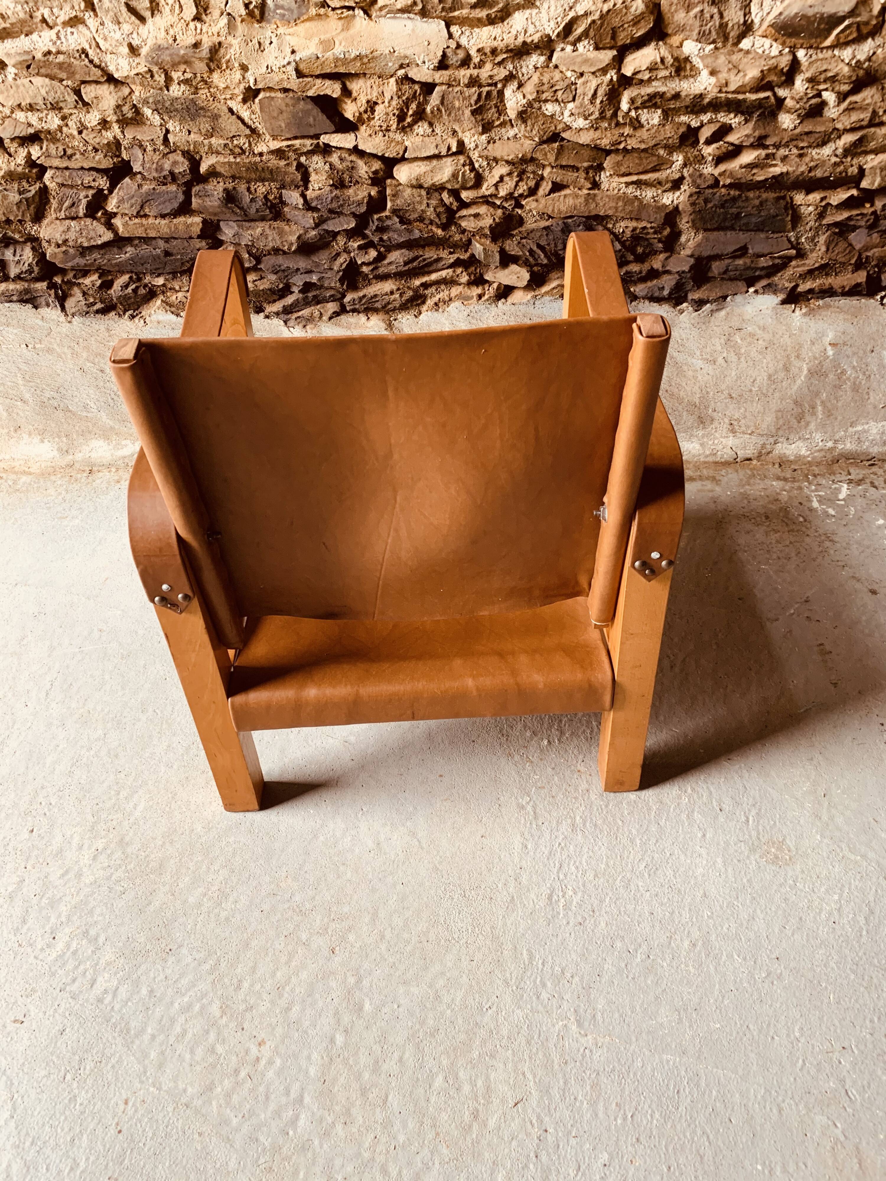 Safari armchair in wood and leather -1950's