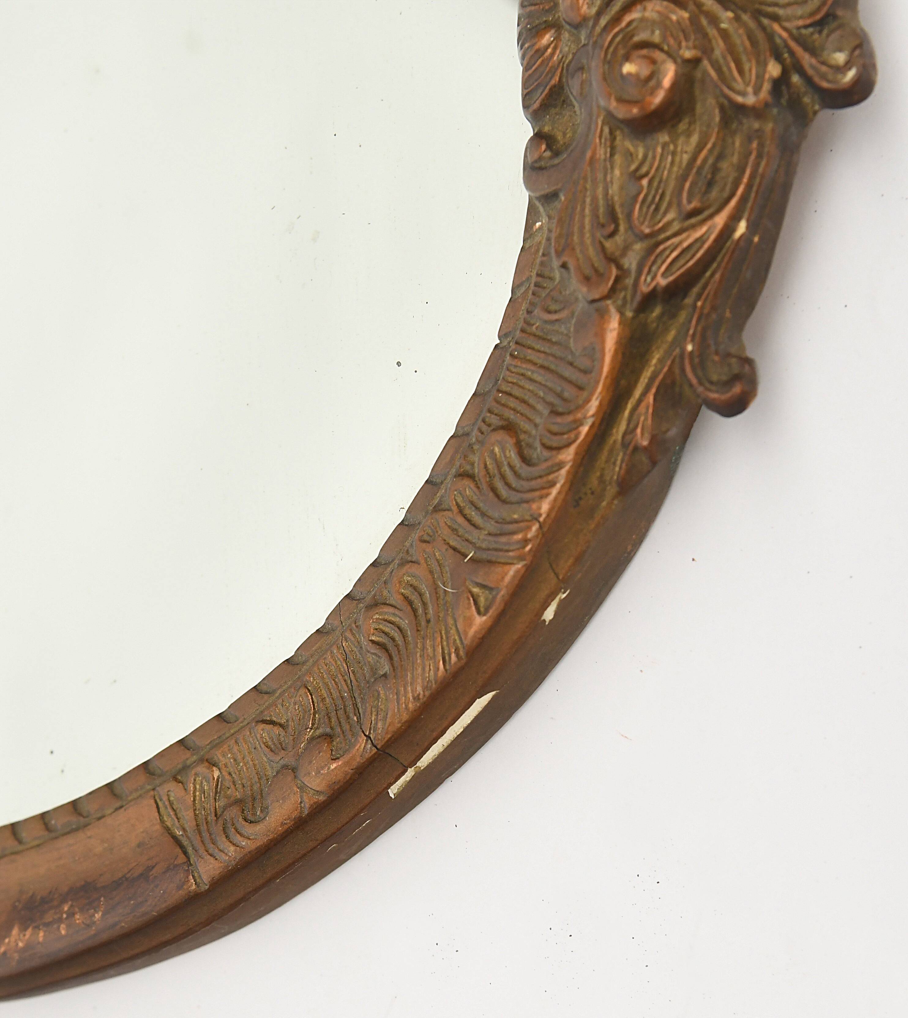 Pair of oval wooden windows with golden patina