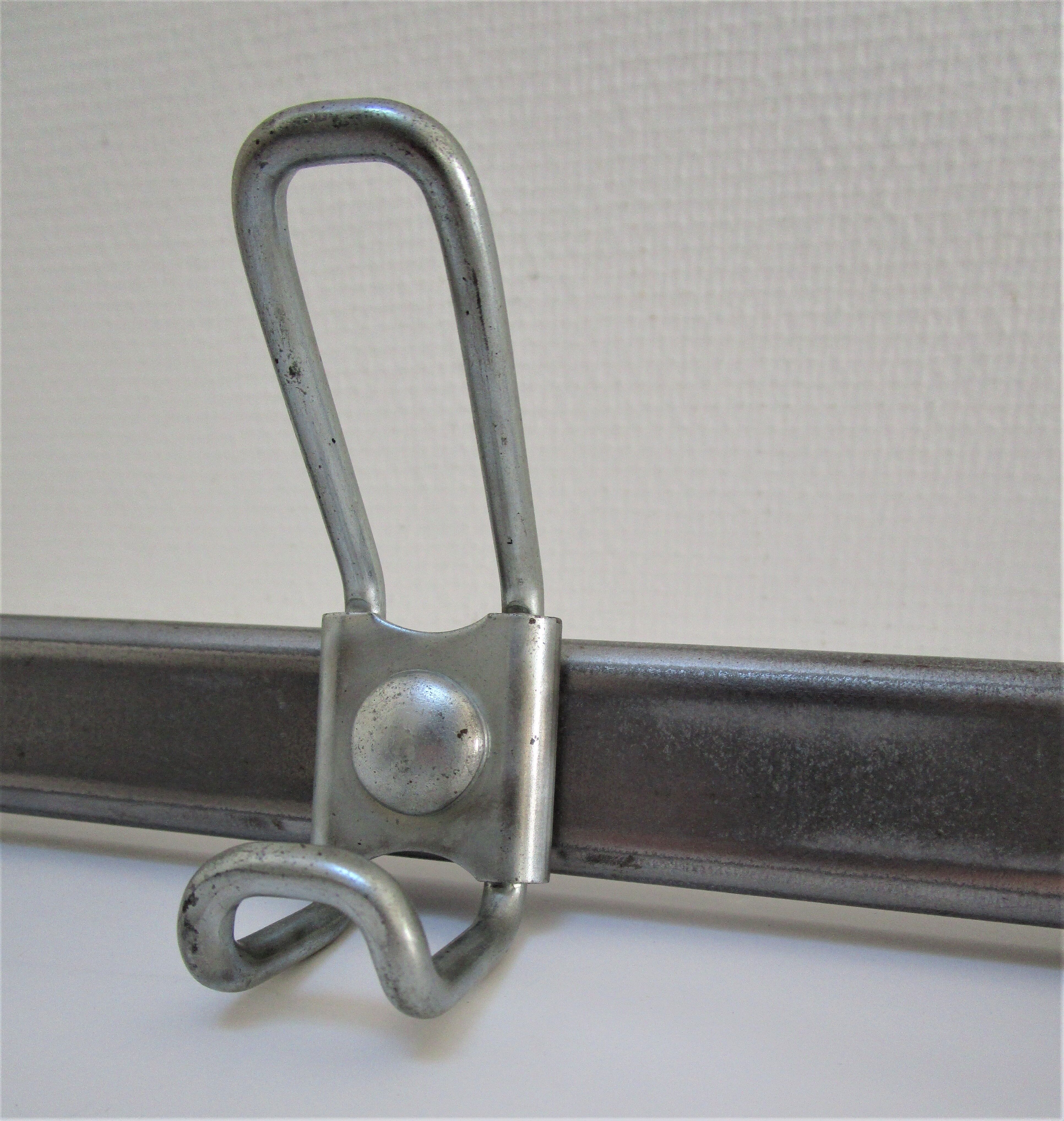 Vintage school wall rack in patinated steel