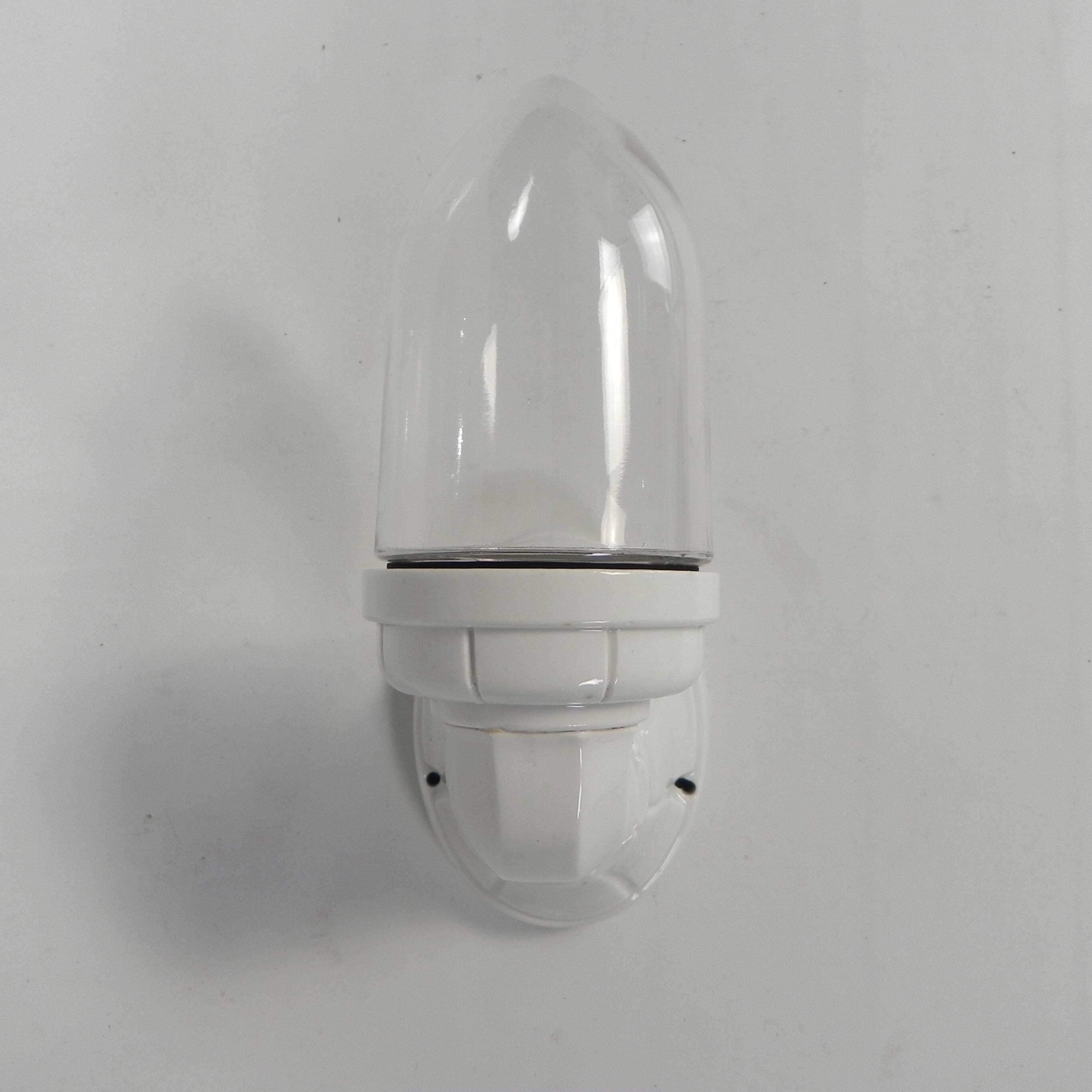 Wall lamp in porcelain with a transparent glass shade, 1930s.