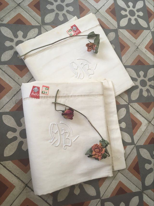 Pair mixed pillowcases embroidered A B.