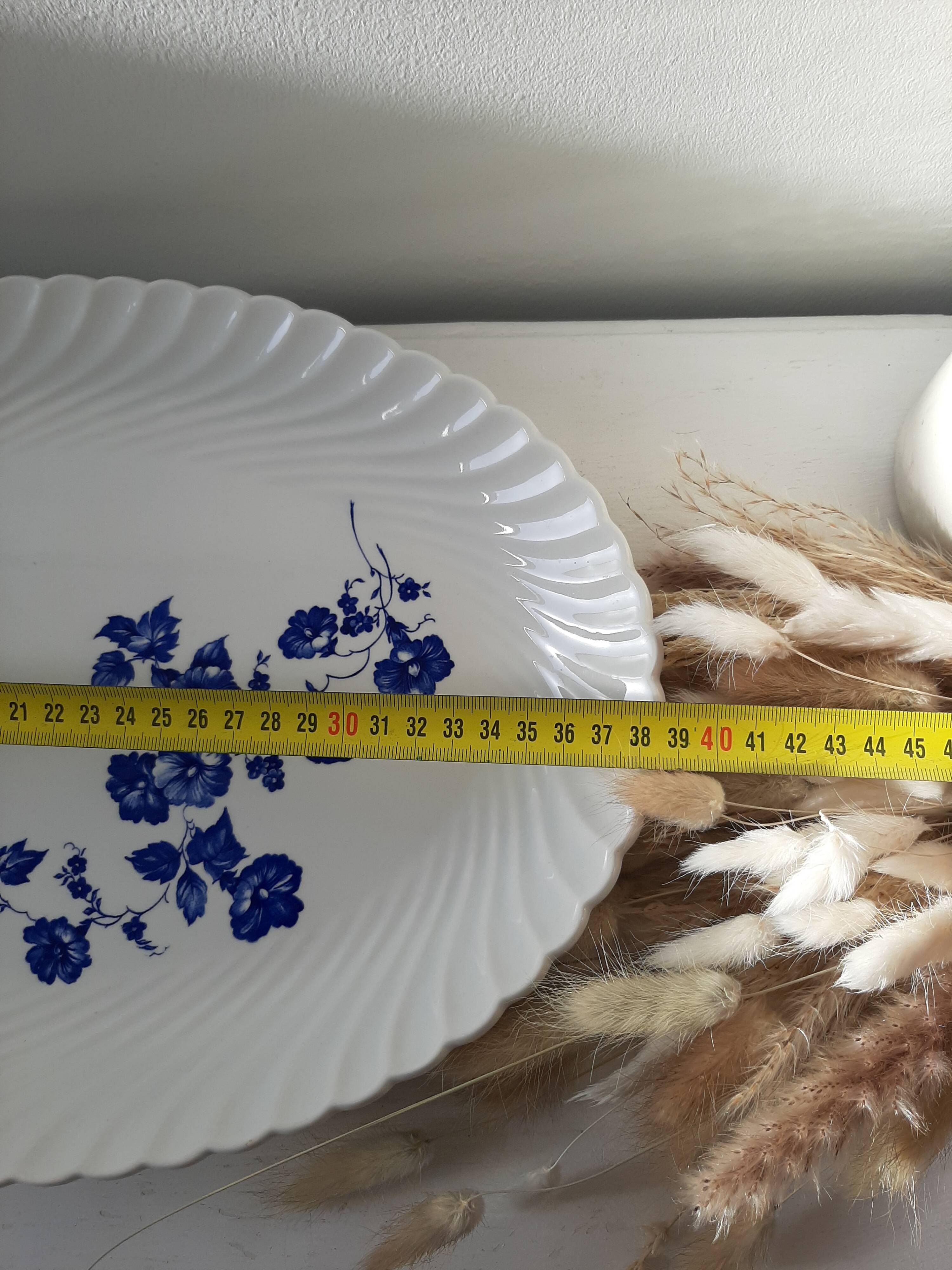 Keller and Guérin Lunéville serving dish with blue flowers on a white background.