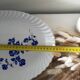 Keller and Guérin Lunéville serving dish with blue flowers on a white background.