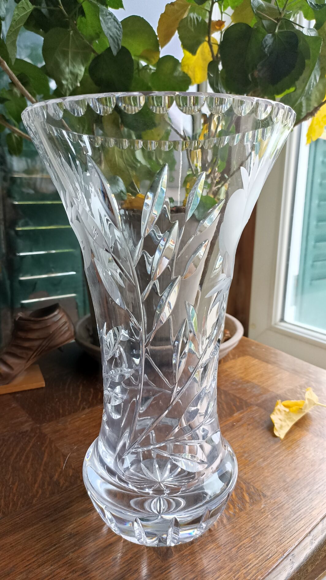 Carved solid crystal vase, floral decoration