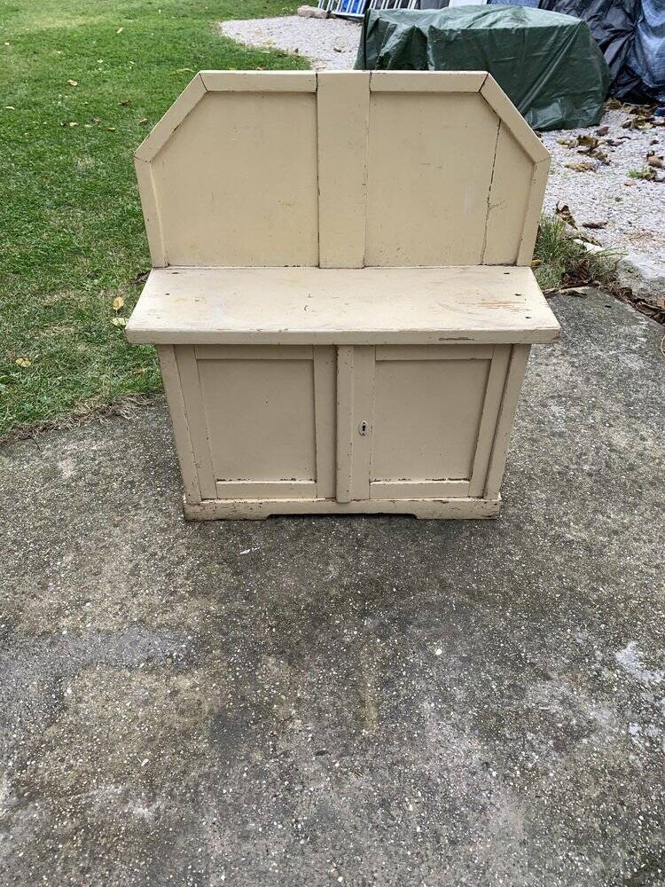 Small vintage yellow bench made of hand-painted wood, low storage from the 1920s.