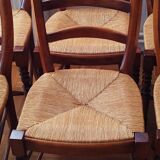 Set of 6 solid wood chairs with high-quality straw seats.