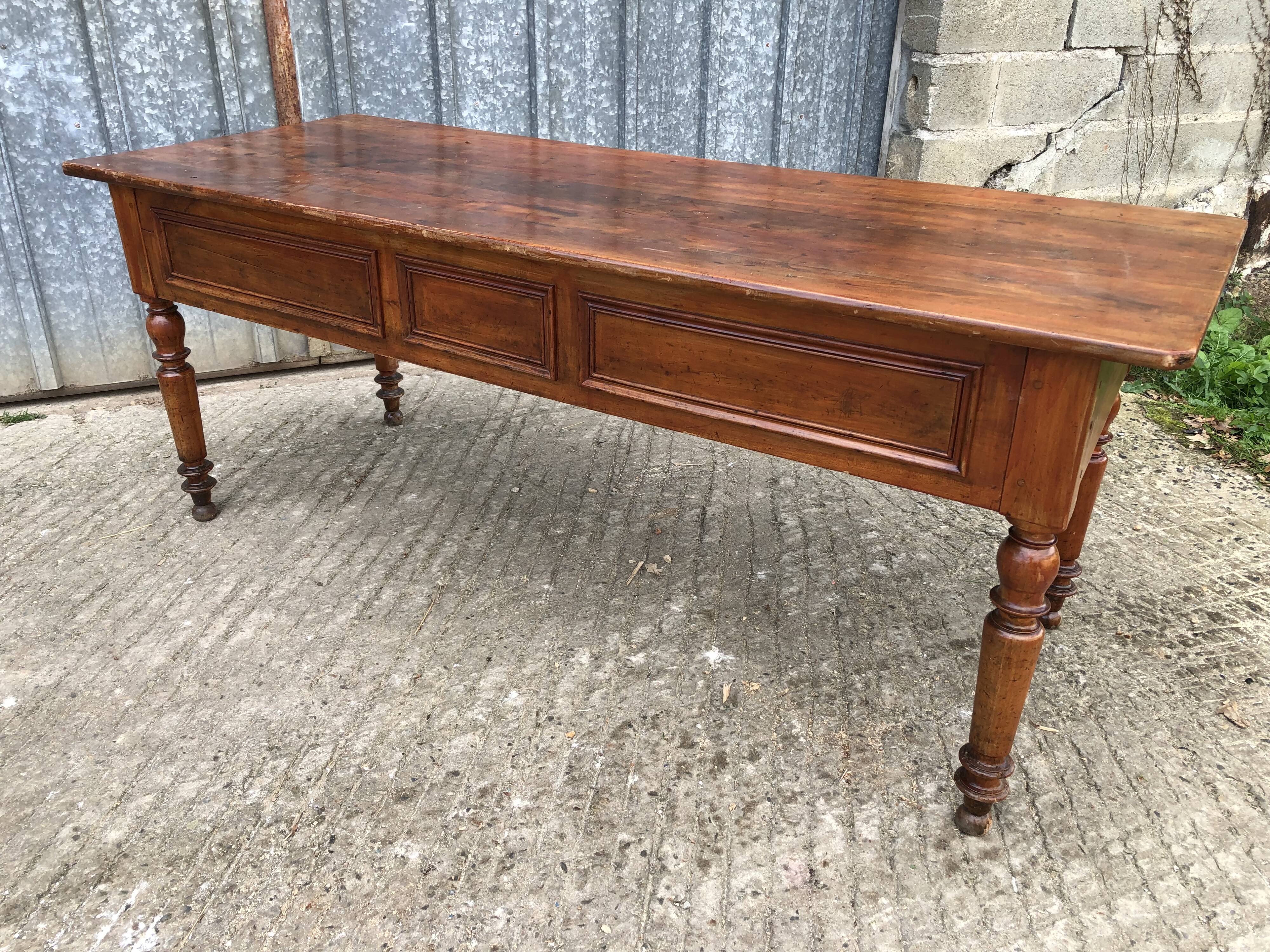 Old farmhouse table in solid cherry wood with 2 front drawers.