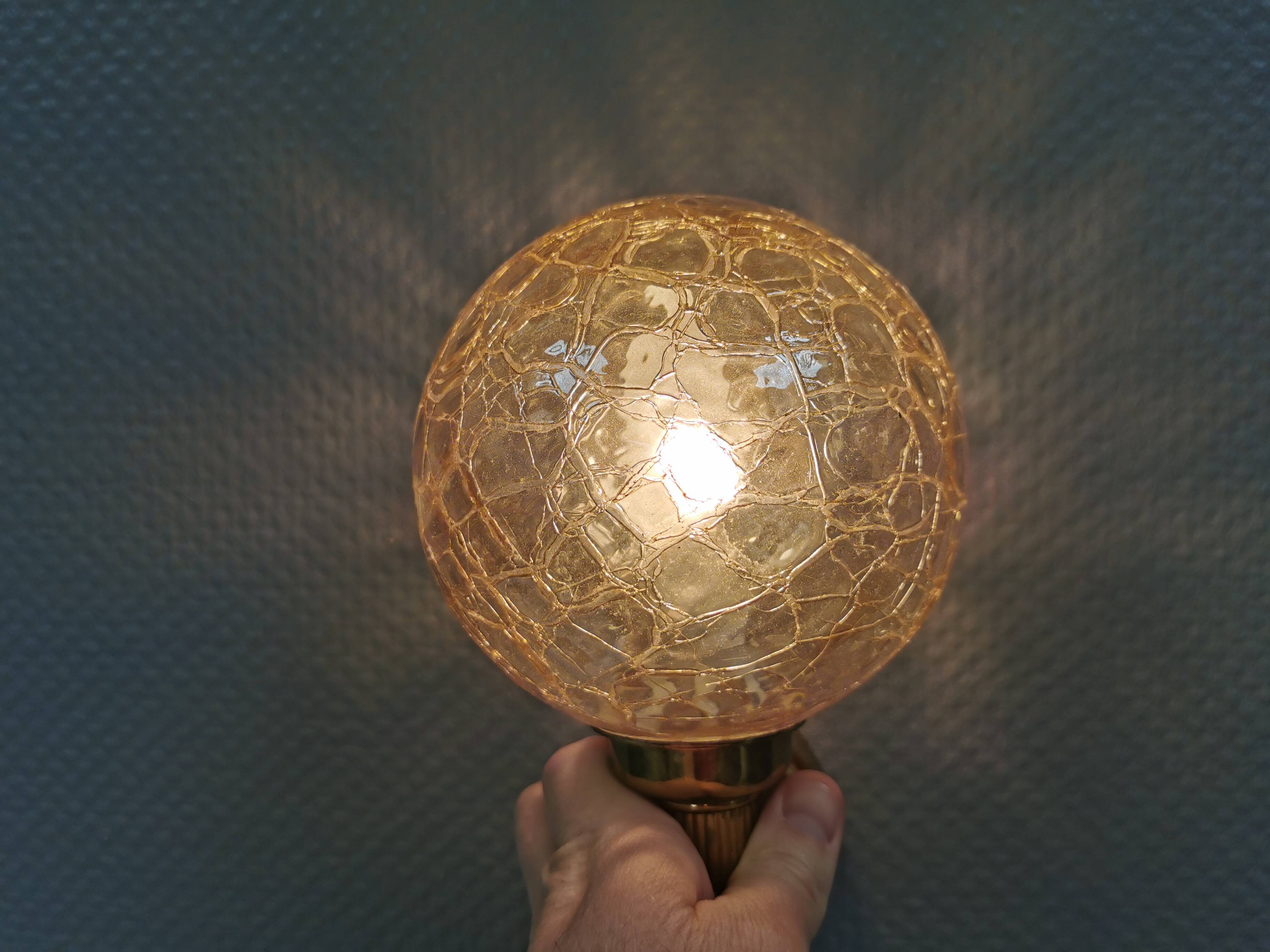 Older wall lamp in metal, brass and “cracked” glass.