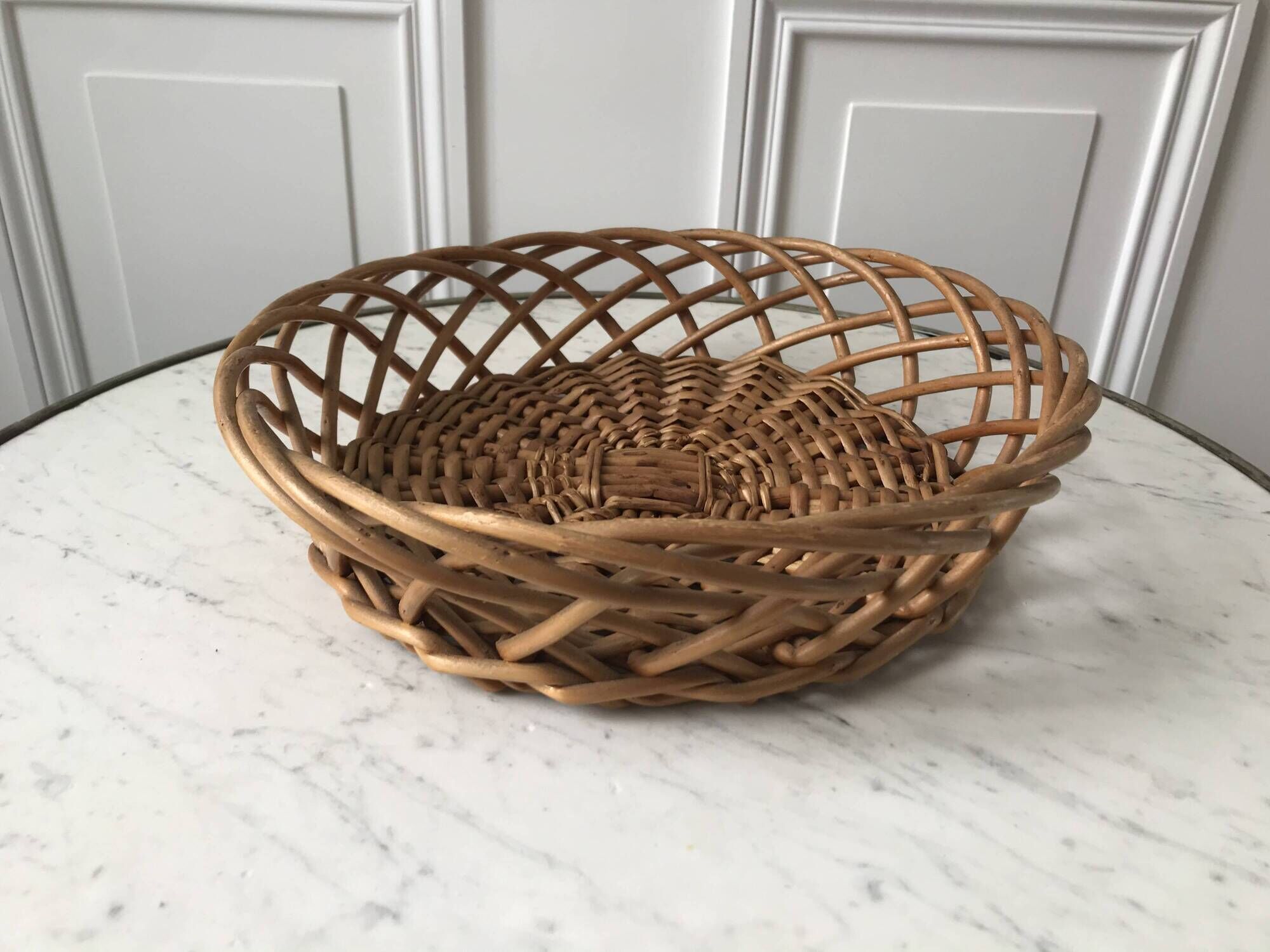 trio of woven rattan and bamboo baskets from the 60s and 70s