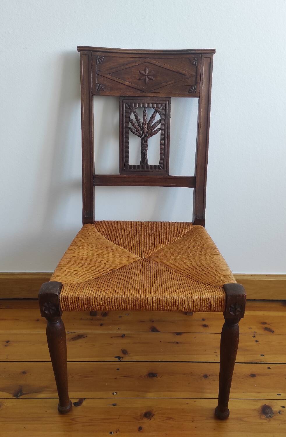 Armchair, low carved chair from the 19th century - decorated with wheat ears.