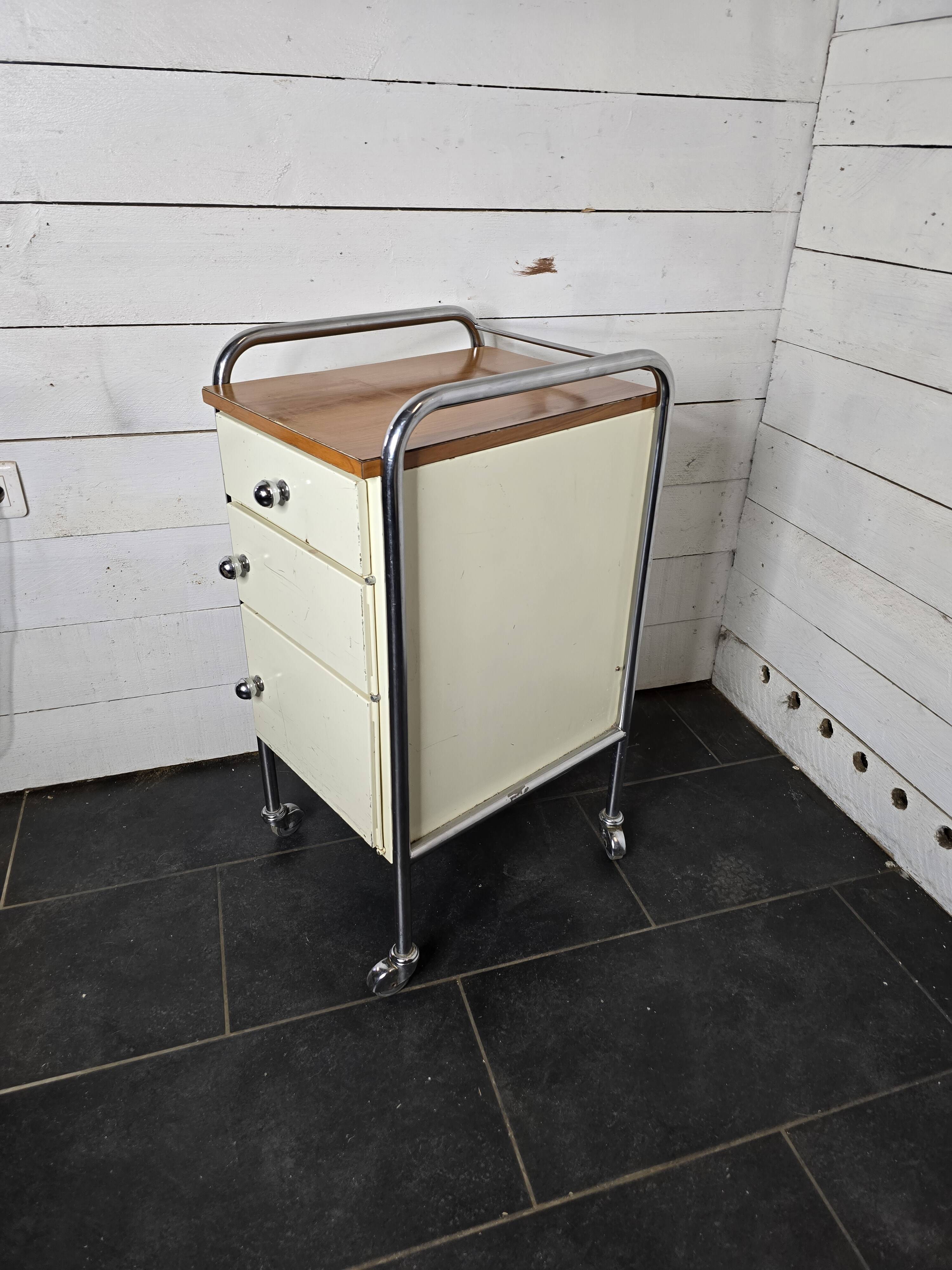 Mid-20th century metal cabinet table on wheels