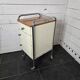 Mid-20th century metal cabinet table on wheels