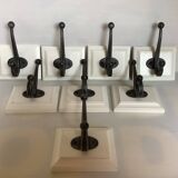 Eight double white wood metal hooks