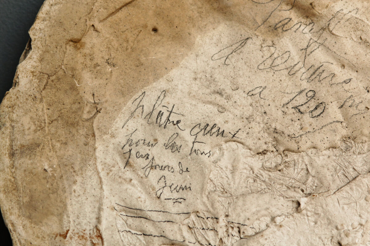 Old plaster medallion, man profile
