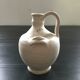 Ivory terracotta jug