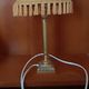 Brass bedside lamp with natural bladder shade.