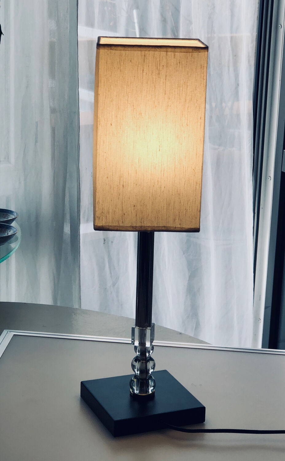 Silver floor lamp with a straight shade.